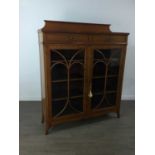 AN EDWARDIAN SATIN WALNUT BOOKCASE