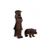 A 19TH CENTURY TREEN NUT CRACKER AND A CARVING OF A BEAR