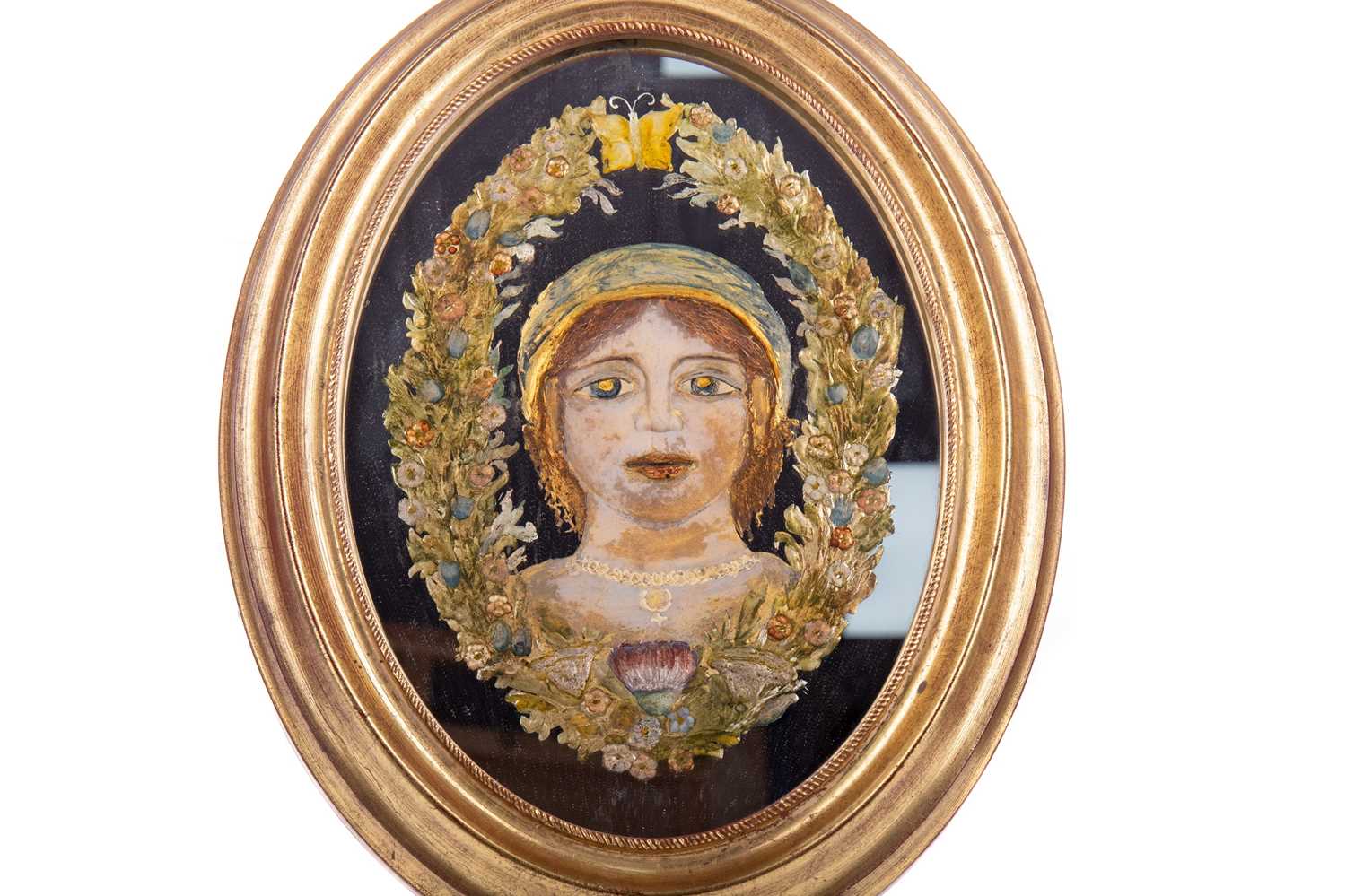 A GERMAN REVERSE PAINTED MIRROR