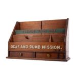 A 'DEAF AND DUMB MISSION' MAHOGANY LEAFLET RACK