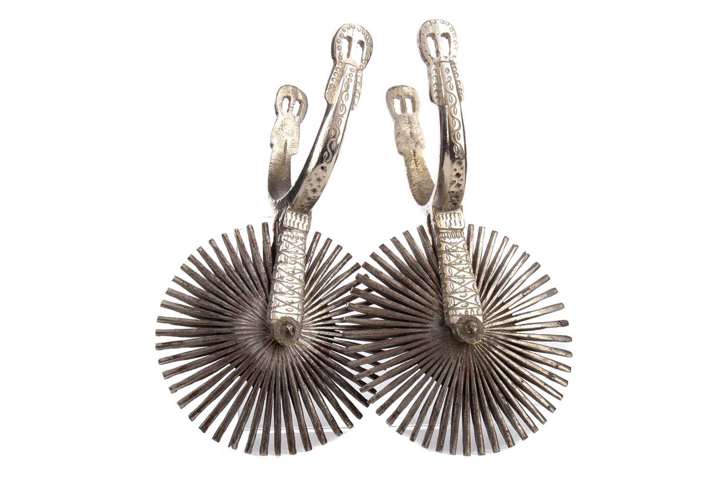 A PAIR OF MEXICAN SILVERED IRON & BRASS SPURS