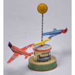 A German lithographed tinplate and plastic clockwork spinning aeroplanes toy, 1960s Slight wear