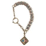 A Ottoman silver coloured metal and coloured glass inset watch fob with star and crescent pendant,