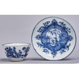 A Worcester blue and white tea bowl and saucer, c1780, transfer printed with the Mother and Child