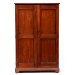 A Victorian mahogany cabinet, c1870, the rounded rectangular top with moulded lip above a pair of