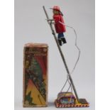 A Japanese lithographed tinplate battery operated  climbing fireman toy,  Linemar [ex] Co Inc, 1960s