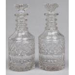A pair of cut glass cylinder decanters and stoppers, first half 20th c, with three cut or plain neck
