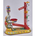 A  German lithographed tinplate and painted wood  clockwork circus elephant toy, c1960 Good