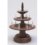 Needlework tools.   A Victorian three tier turned walnut horn and bone bobbin and thimble stand, mid