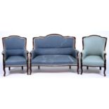 A mahogany framed three piece lounge suite, early 20th c, comprising two seater sofa and pair of