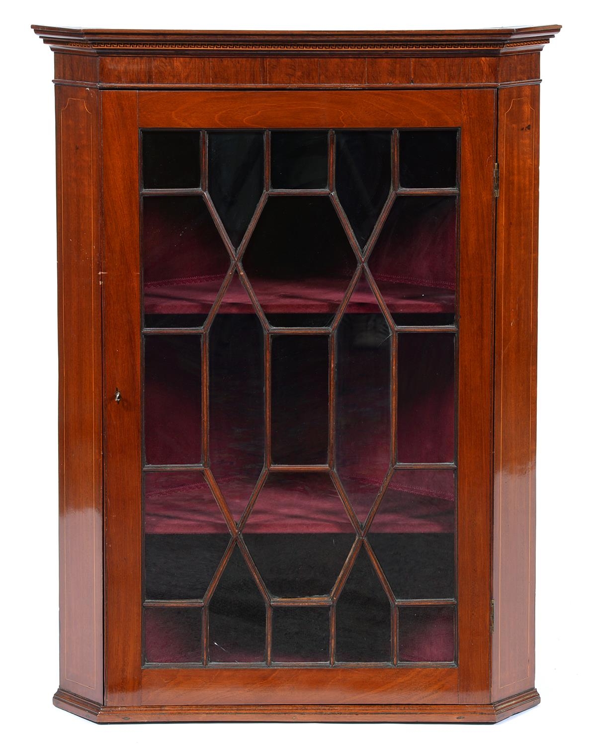 A mahogany and line inlaid hanging corner cabinet, 19th c, of splay fronted form, 110cm h Good