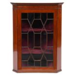 A mahogany and line inlaid hanging corner cabinet, 19th c, of splay fronted form, 110cm h Good