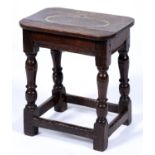 An oak joyned stool, 17th c, on baluster legs with stretchers, 51cm h Boarded seat replaced