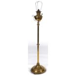 A Victorian brass telescopic oil lamp, with scroll mounted reservoir and burner, on knopped