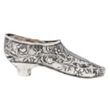 An ornate Dutch silver pin cushion in the form of a shoe, c1900, 70mm l, spurious 18th c marks and