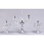 A cut glass lustre garniture of candelabrum and candlesticks, late 20th c, candelabrum with  central