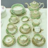 A Coalport tea and coffee service, c1830,  of Adelaide shape,  decorated in an apple green and