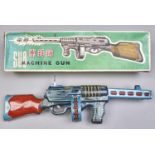 A Chinese lithographed tinplate  battery operated toy machine gun, c1970 with blue plastic