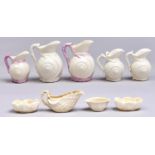 Five Belleek Shell cream jugs, another and one and a pair of salt cellars, 1863-1946, largest jug