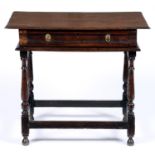 A William III oak side table, c1700, the moulded front with drawer, on baluster legs united by
