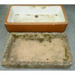A shallow sandstone rectangular sink with rounded front right corner, 95 x 58cm, 13cm deep and a