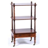 A William IV rosewood whatnot, of three beaded tiers with spiral uprights, fitted with a drawer,