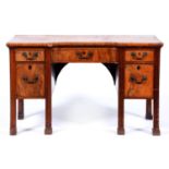 A mahogany sideboard in George III style, late 19th c, the top above concave centre drawer flanked