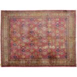 An antique Turkish carpet, with pink ground, first half 20th c, 457 x 522cm Wear; holed; stained