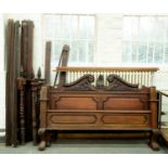 A carved and stained walnut half tester bed, with panelled head and footboard and leafy swan neck