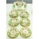 A Coalport green batwing pattern tea service, 1925, shaped square plate 27cm over handles, printed