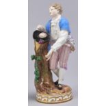 A Meissen figure of a youth with a bird's nest, late 19th c, on round gilt base, 18.5cm h, incised
