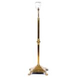 An Edwardian telescopic brass oil lamp standard, on square base and paw feet, converted to