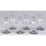 A set of six glass goblets, early 20th c, on waisted stem and spreading foot, 16cm h Good condition
