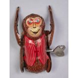 A Chinese lithographed tinplate clockwork Tumbling Monkey toy, c1970s Working order