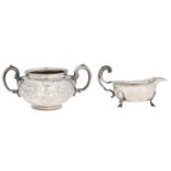 A Victorian silver sugar bowl, with C-scroll handles and engraved cartouche, crested, 11cm h, by