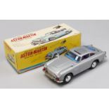 [James Bond]. A Japanese tinplate and  plastic friction driven and battery operated Aston Martin,