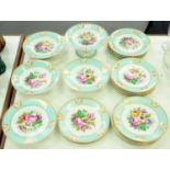 A French porcelain dessert service, c1870, the bowls painted with a colourful group of flowers