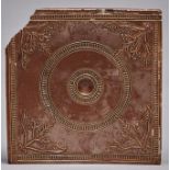 An English saltglazed brown stoneware wall tile, Nottingham, c1750, with central concavity within