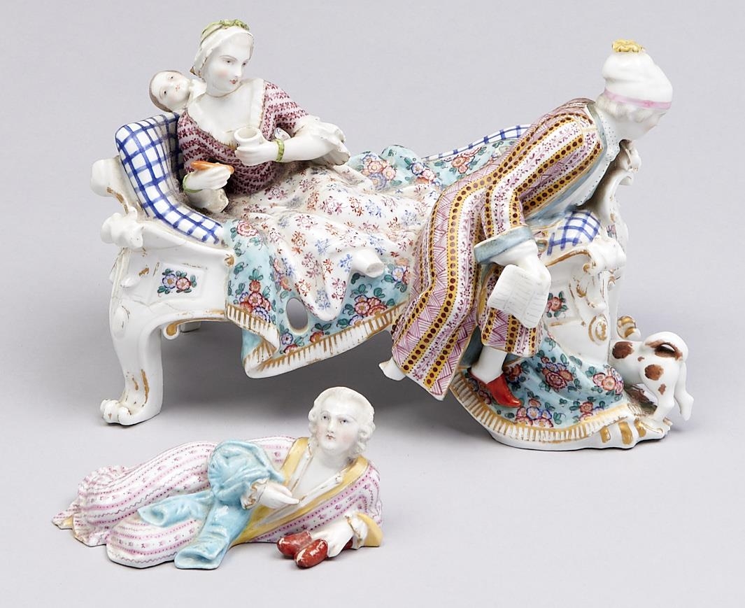 A Meissen group of a family on a couch, early 19th c, 17cm h, crossed swords and a Meissen figure of