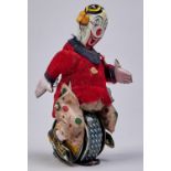 A Japanese lithographed tinplate, felt and cotton cloth clockwork toy - Skippy the Trick Unicyclist,