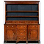 An oak dresser, North Wales, first half 19th c, the boarded rack with row of five scratch moulded