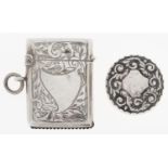 A George V silver vesta case, 35mm h, by W H Haseler Ltd, Birmingham 1912 and a Victorian silver