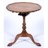 A carved mahogany tripod table, in George II style, with birdcage action, 60cm diam Faded