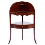 A George III mahogany corner washstand, 106cm h Re-polished, basin aperture filled with a piece of