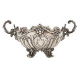 A George V rococo revival silver sweetmeat basket, with cast c-scroll handles, on pierced feet,