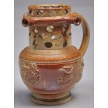 An English saltglazed brown stoneware puzzle jug, Brampton, Derbyshire, c1835, of honey colour