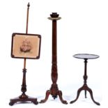 An early Victorian rosewood pole screen, with later woolwork banner of a ship, a mahogany tripod