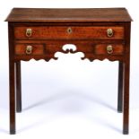 A George III oak lowboy, with pierced apron, the brass ring pulls apparently original, 78cm l Good