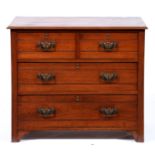 An Edwardian walnut chest of drawers, the rectangular top with moulded lip above two short over