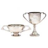 A George V silver trophy cup, 16cm over handles, by W H May, Chester 1934 and another of goblet form